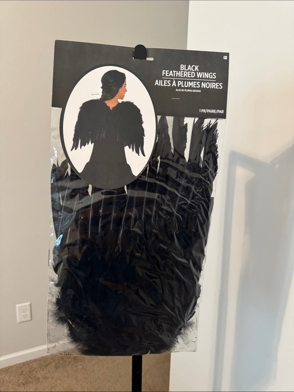 Adult black feather wings. New in bag
